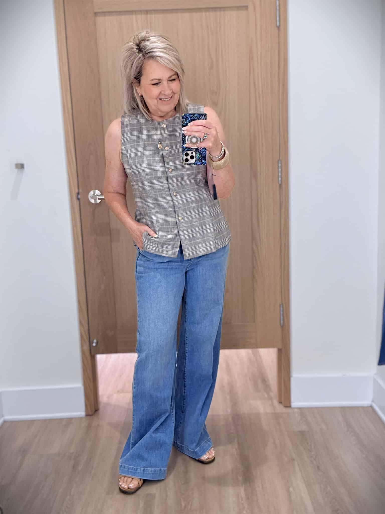Tania wearing a plaid vest with wide leg trouser jeans from Ann Taylor