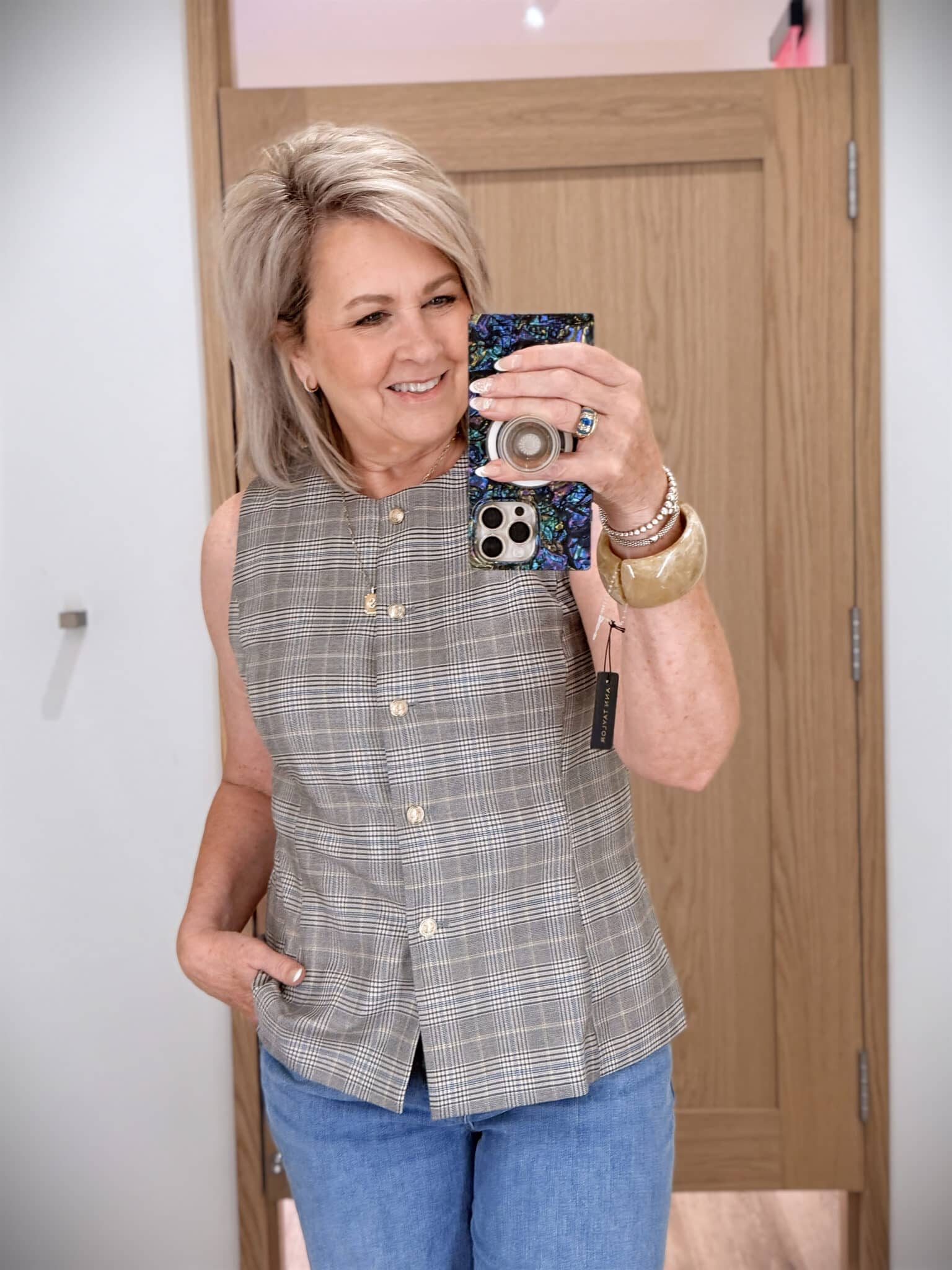 Tania wearing a plaid vest from Ann Taylor