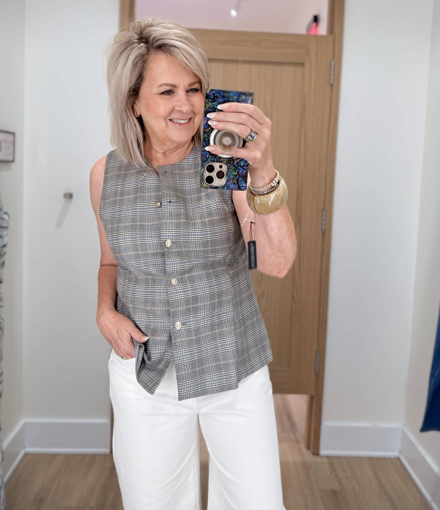 Tania wearing a plaid vest from Ann Taylor