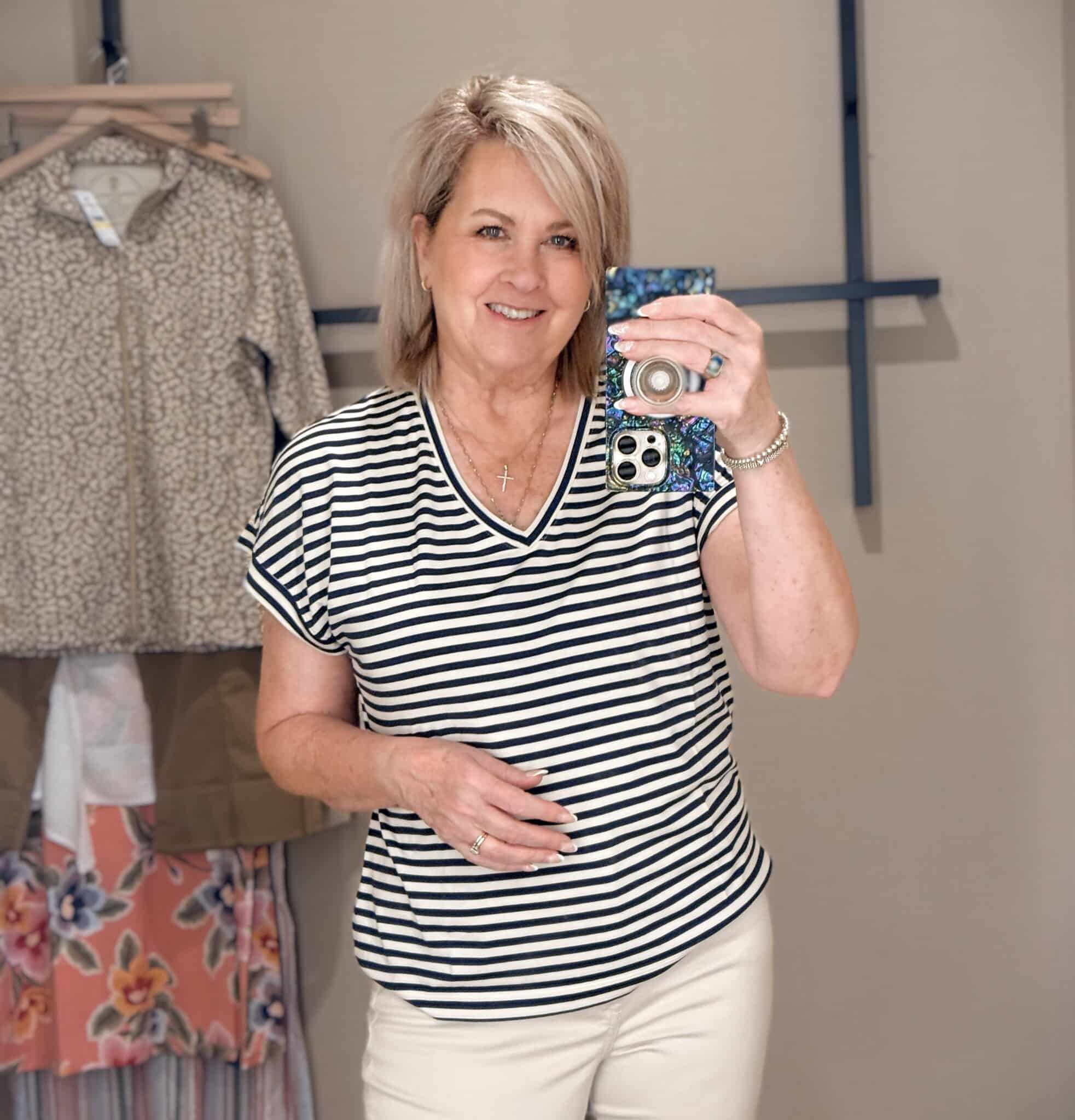 Tania wearing a striped v-neck shirt from Tommy Bahama