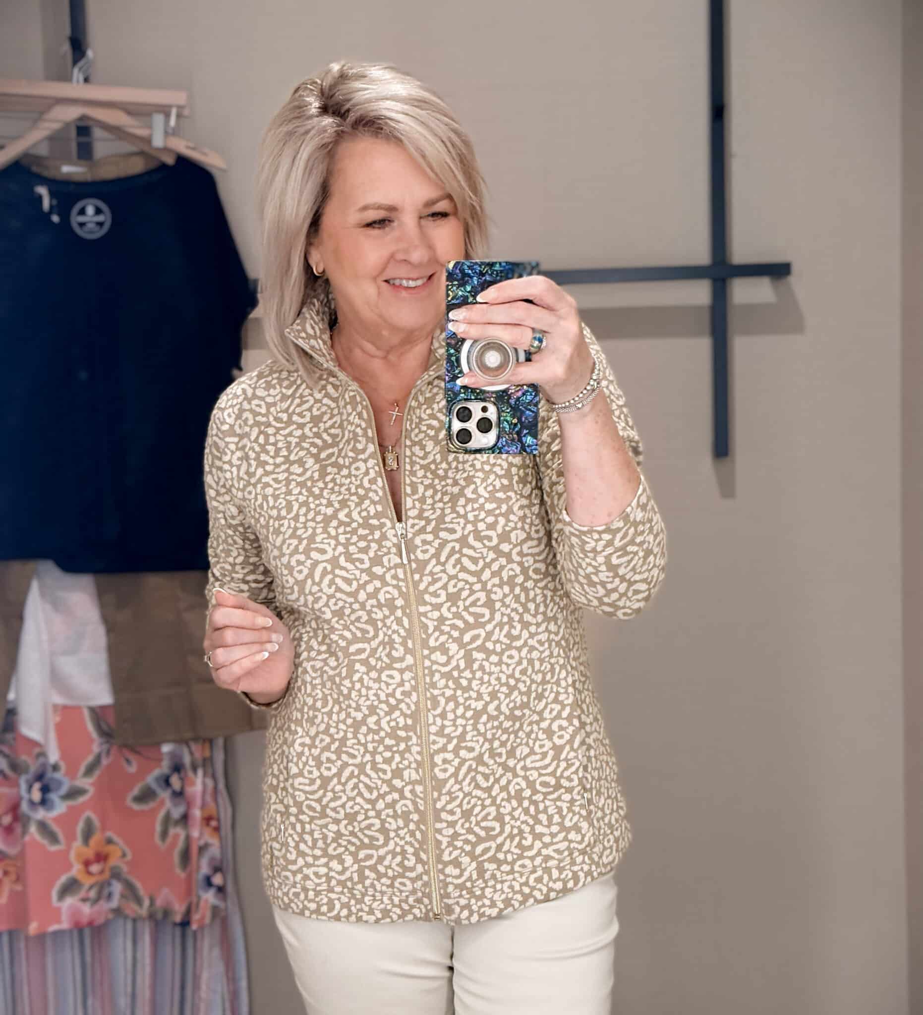 Tania wearing a leopard print 1/4 sweatshirt from Tommy Bahama