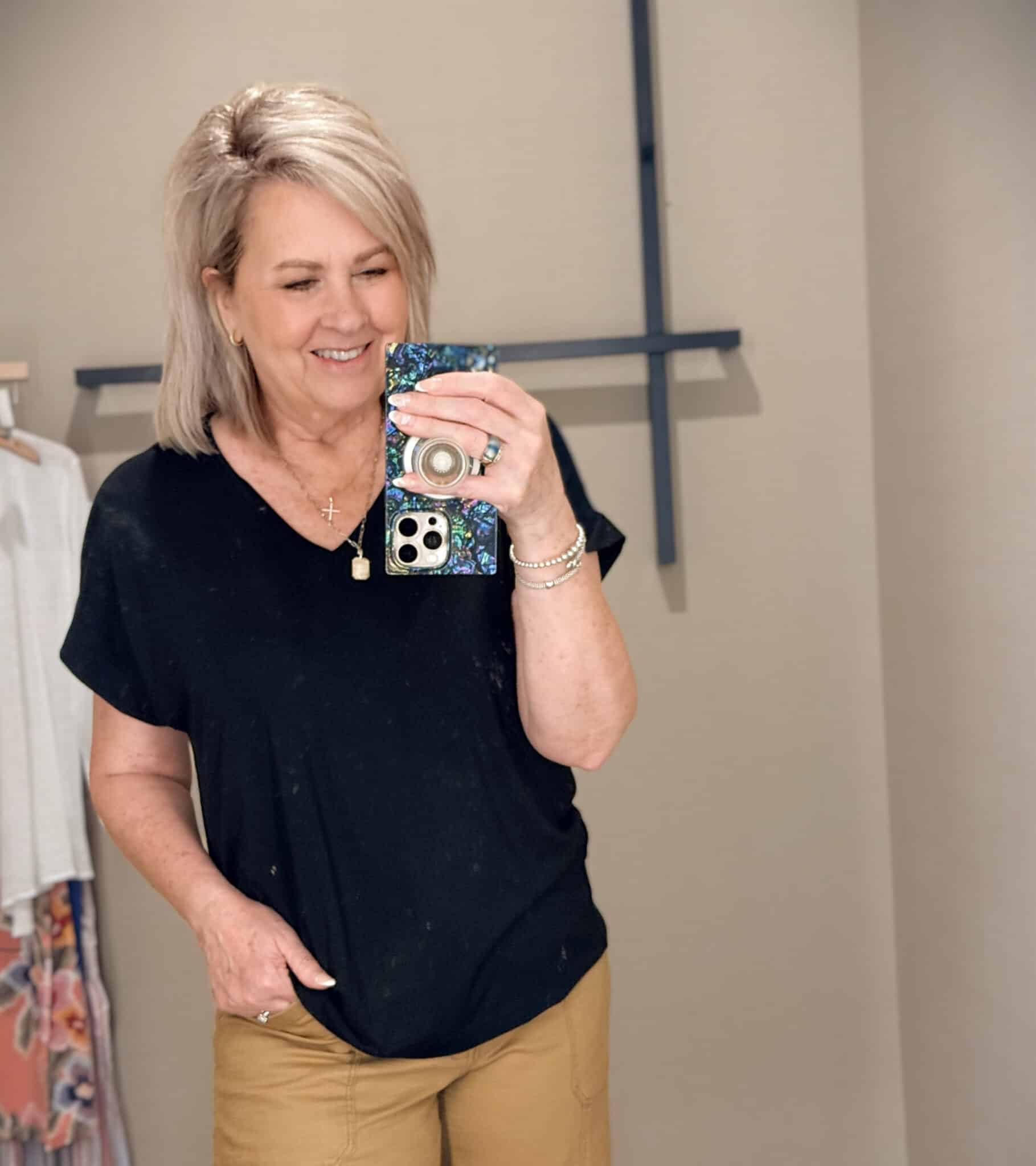 Tania wearing a black v-neck t-shirt from Tommy Bahama