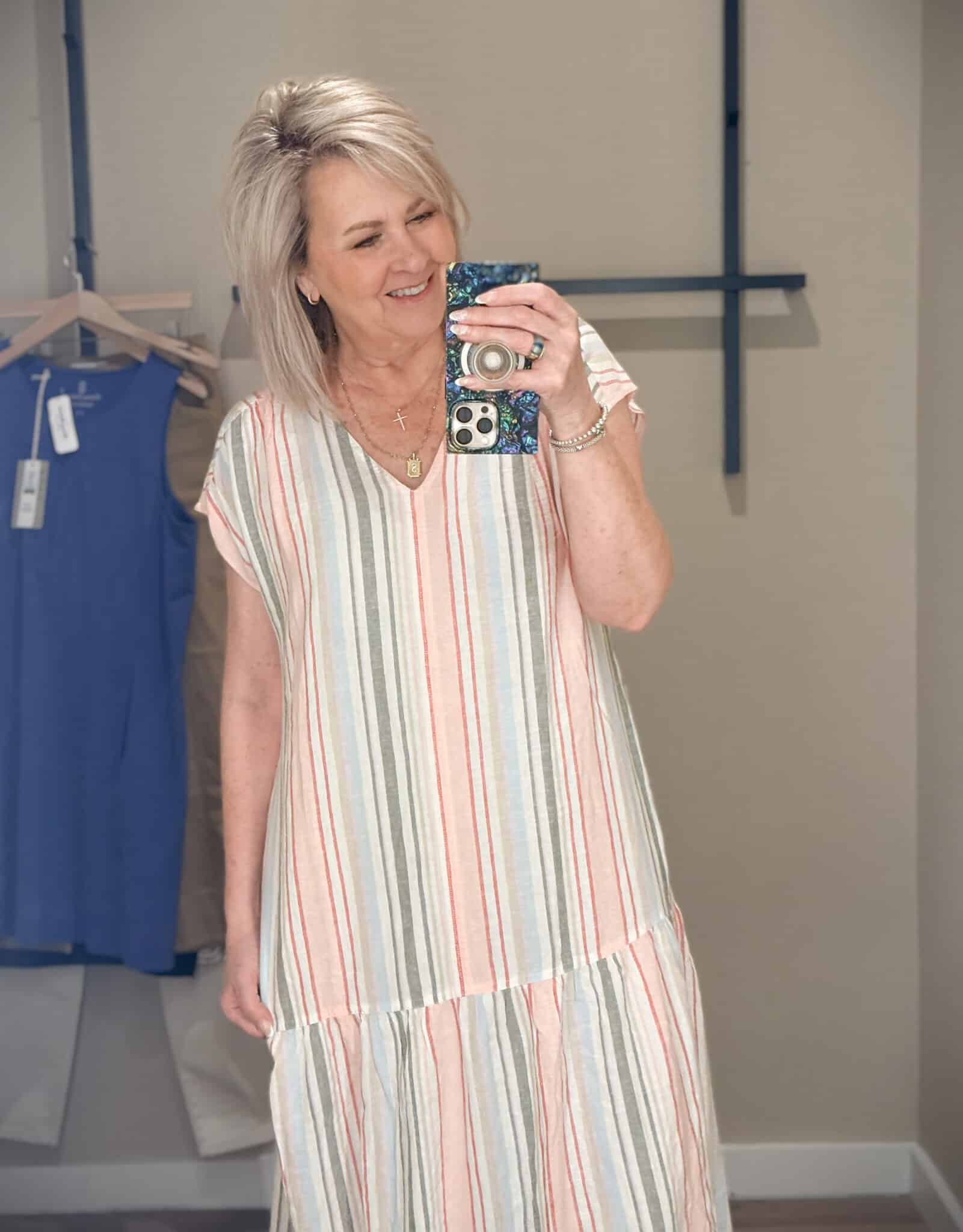 Tania showing a close-up of a drop waist striped maxi dress from Tommy Bahama