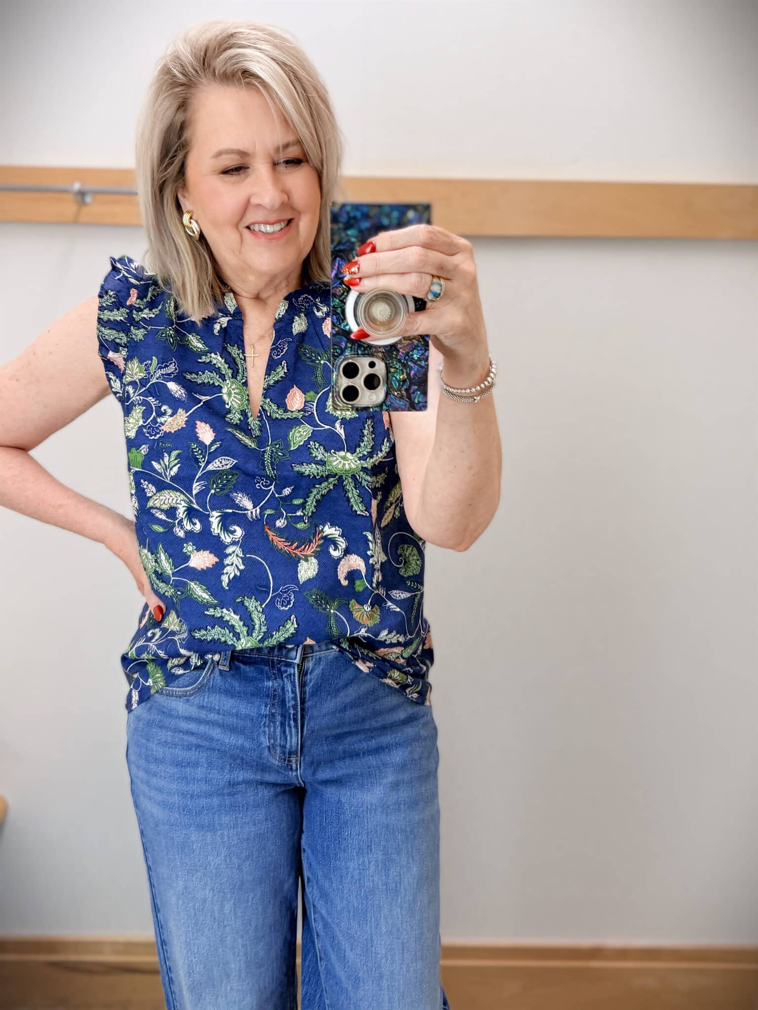 Tania wearing a floral ruffled shell from Talbots