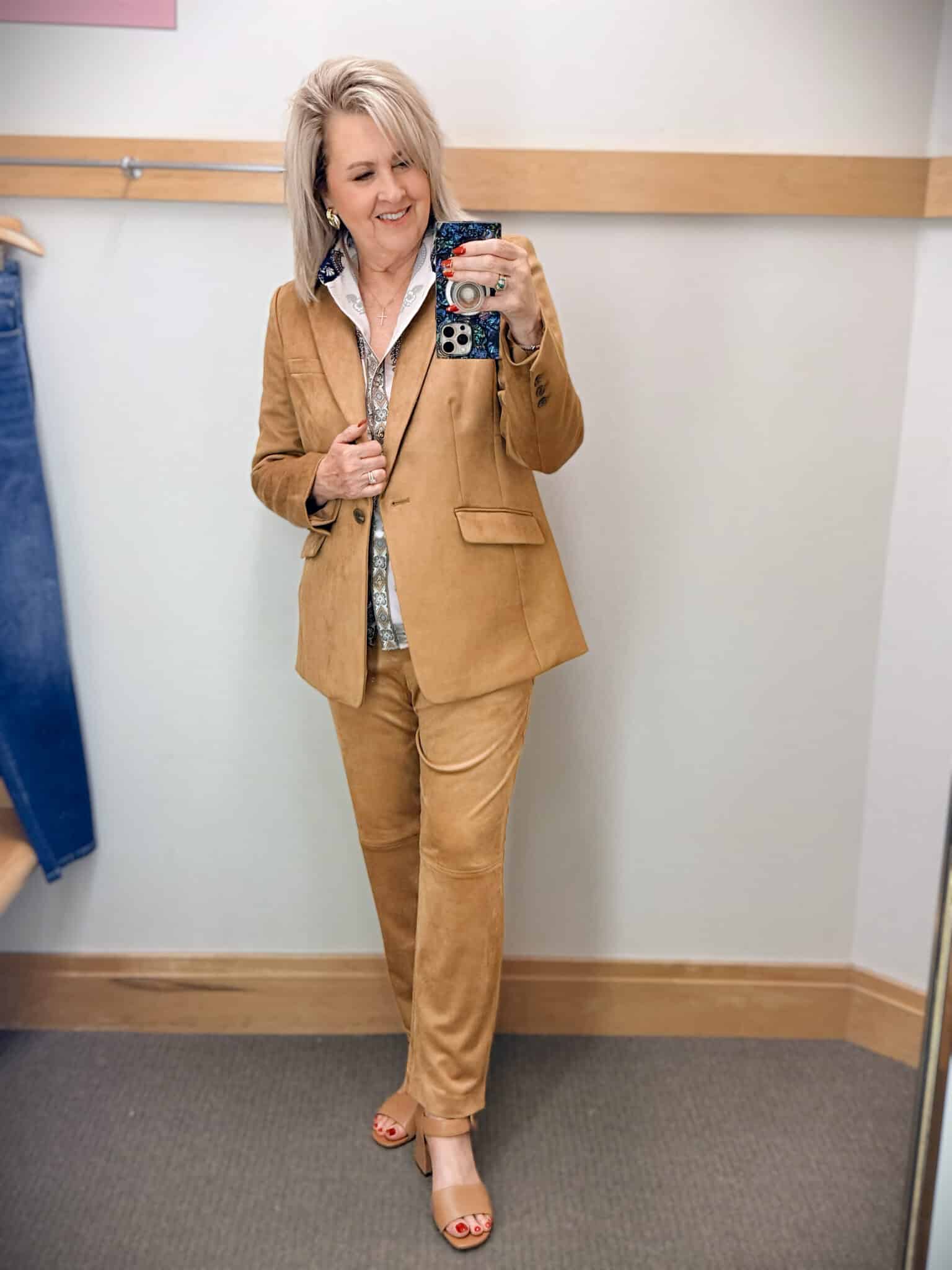 Tania wearing a satin paisley button up shirt with a pair of faux suede pants and a matching blazer from Talbots