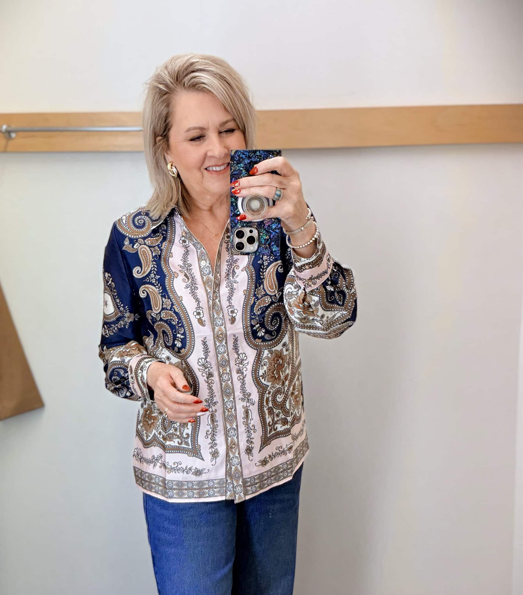 Tania wearing a satin paisley button up shirt from Talbots