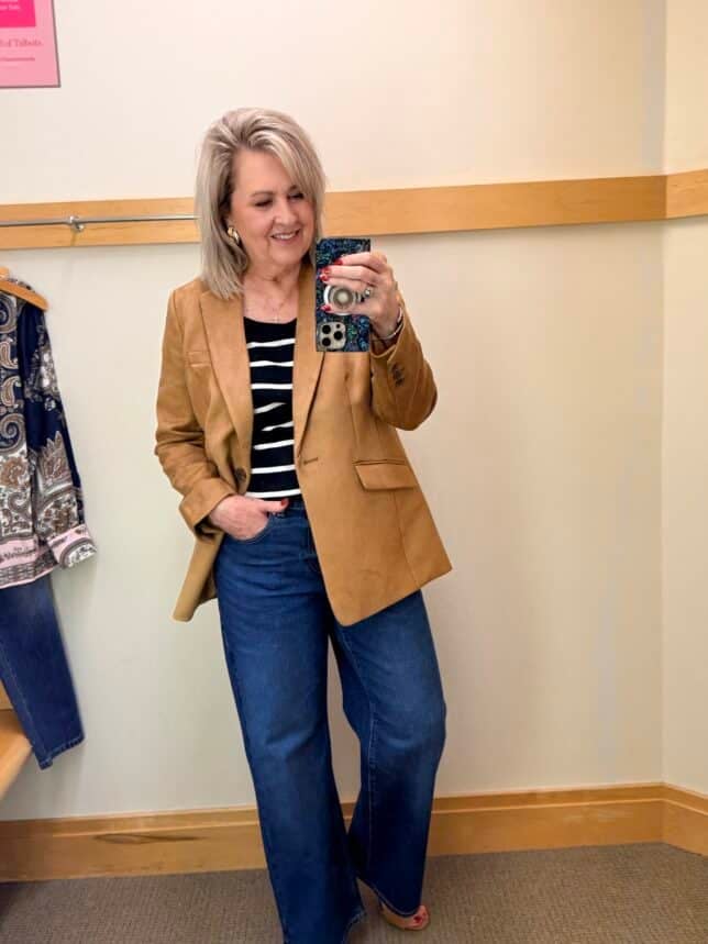 Tania wearing a striped scoop neck tee with a pair of dark wash trouser jeans and a faux suede blazer from Talbots