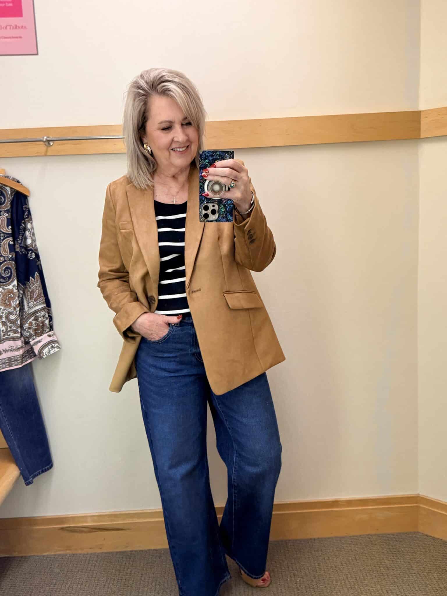 Tania wearing a striped scoop neck tee with a pair of dark wash trouser jeans and a faux suede blazer from Talbots
