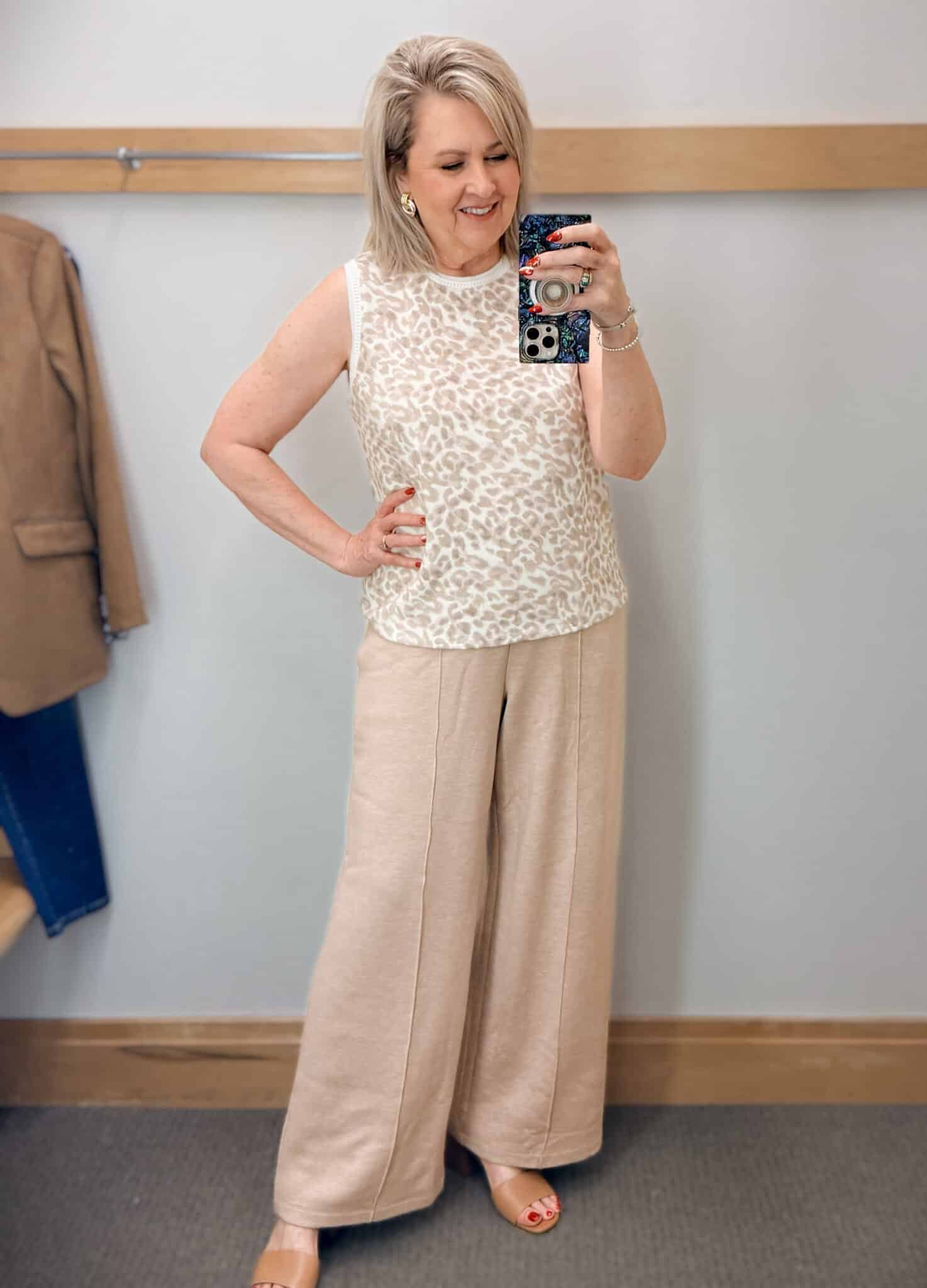 Tania wearing a leopard print airknit shell with flowy knit pants from Talbots