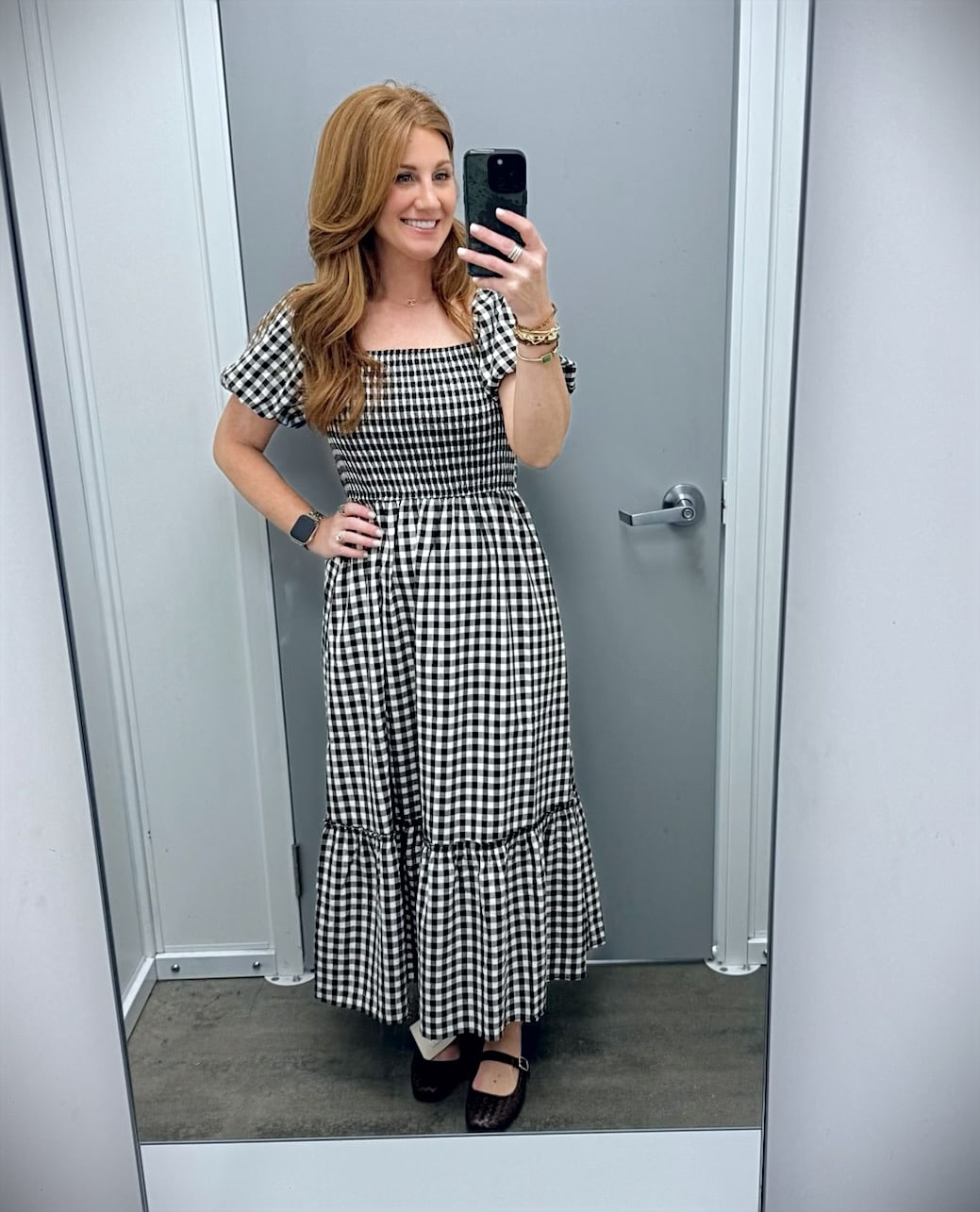 Stephanie wearing a gingham puff sleeve dress