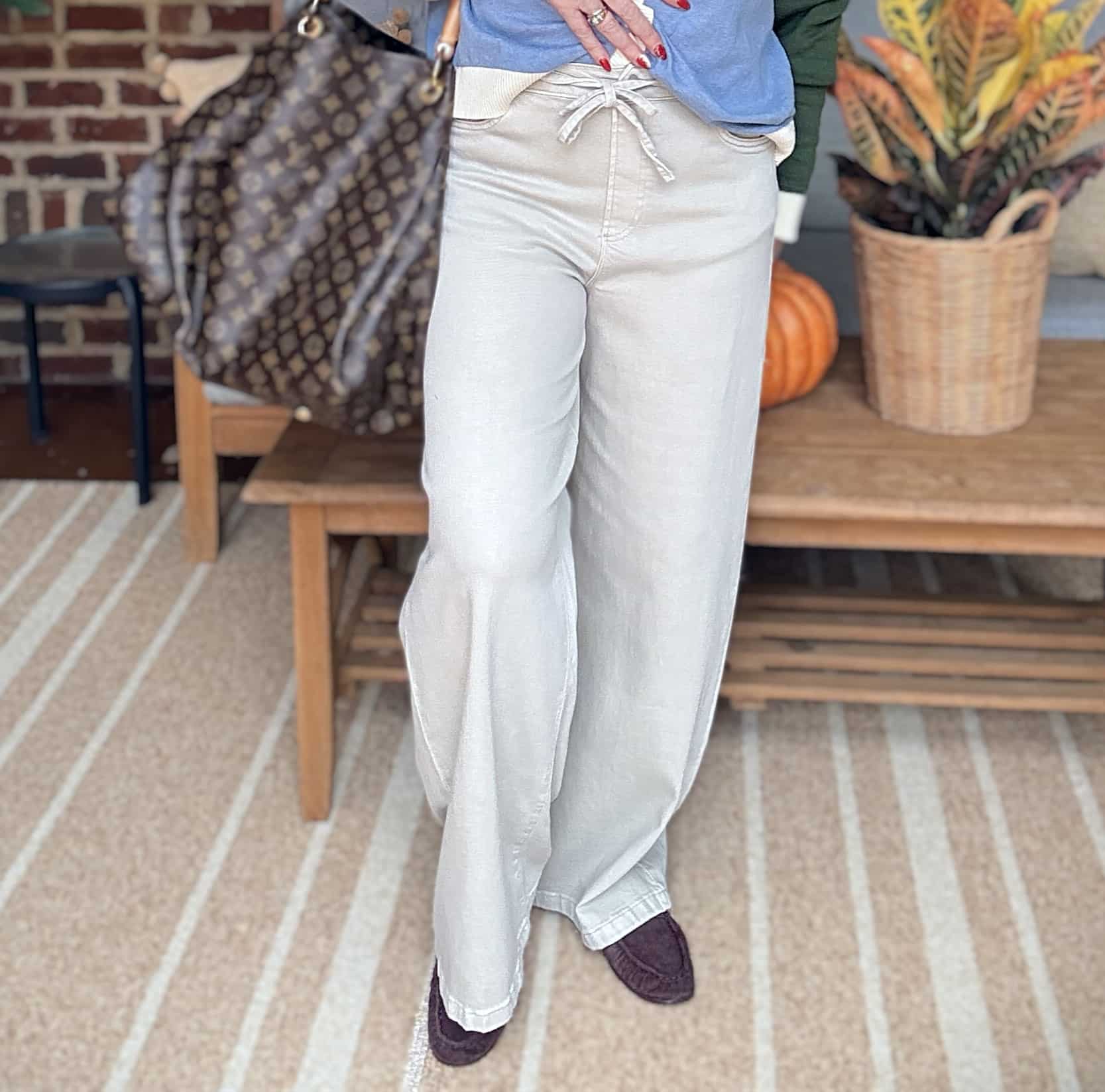Tania wearing beige drawstring pants for fall