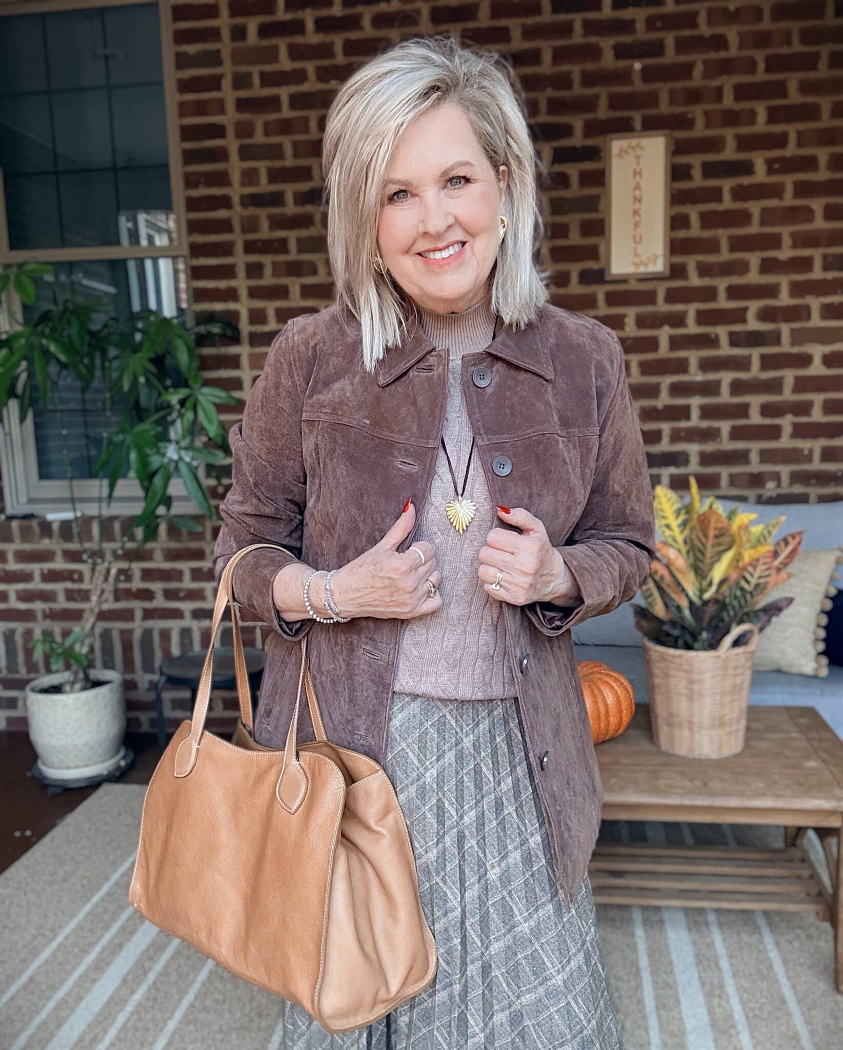 Tania wearing a chocolate brown suede jacket