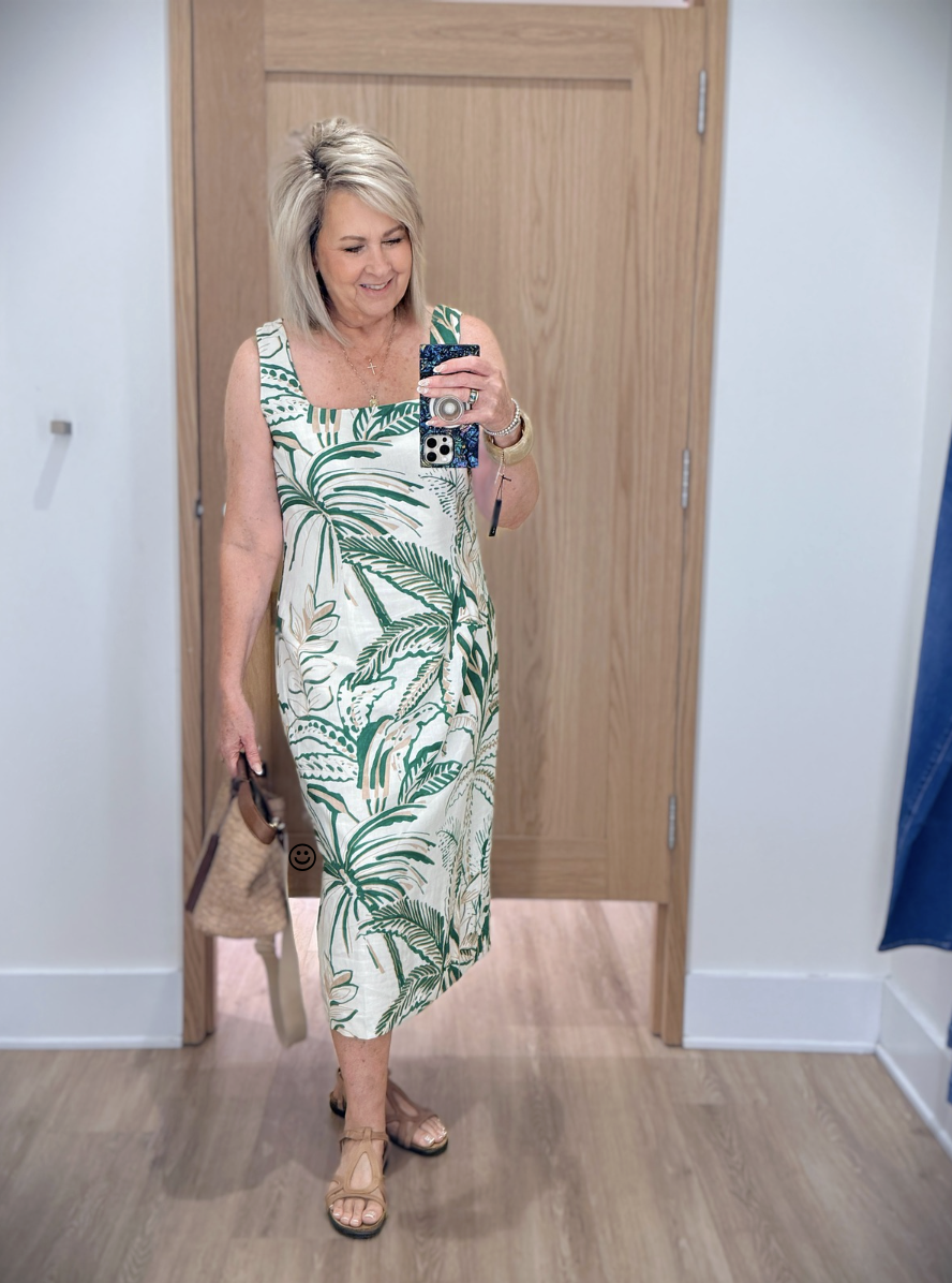 Tania wearing a green and white square neck dress from Ann Taylor