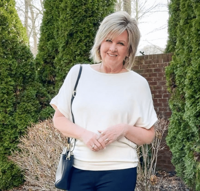 Tania wearing a Quince Dolman Sleeve Sweater