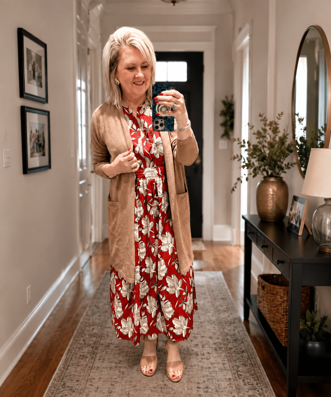 Tania wearing a J.Jill floral dress with a long brown cardigan